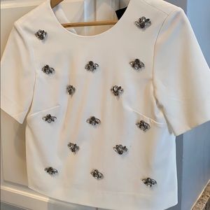 White top with silver jeweled accents